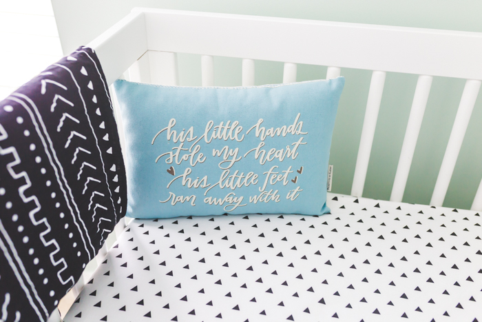 boho baby boy pillow in crib with tribal details