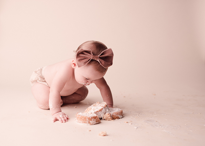 one year-old diving into cake