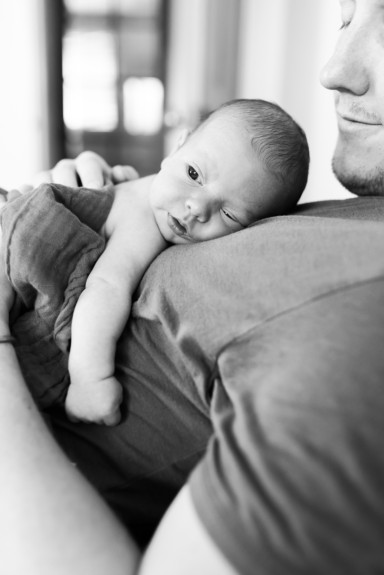 family lifestyle photos, newborn with dad, black and white photo